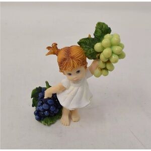 Adorable Figurine with Grapes